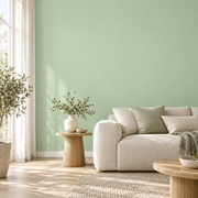 Papier peint vert sauge en situation dans un salon lumineux.